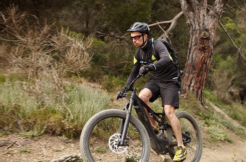 handosme-confident-male-cyclist-in-protective-gear